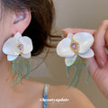 White Orchid Drop Earrings with Green Swallow Shaped Dangles view 1