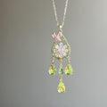 Floral Crystal Teardrop Earrings and Necklace with Polished Metal Details view 2