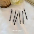 Black Wavy Bobby Hair Pins In A Fifty Piece Set For Styling view 3