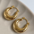 Rounded Chunky Hoop Earrings with Smooth Gold Tone Finish view 6