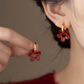 Red Flower and Gold Tone Huggie Drop Earrings with Detailed Finish view 2