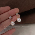 Gold Tone Clear Stone Snowflake And Irregular White Pearl Earrings view 4