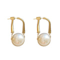 Gold Tone Faux Pearl Drop Huggie Earrings With Decorative Metal Details view 5