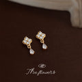 Gold Tone Clear Stone Four Petal Flower Teardrop Stud Earrings view 3
