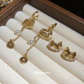Gold Tone Rocking Horse Earrings with Coin Chain Tassels view 3