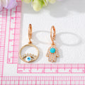 Gold Tone Crystal Hamsa and Evil Eye Huggie Drop Earrings view 5
