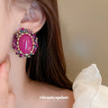 Pink Oval Crystal Vintage Style Stud Earrings with Polished Metal Accents view 3
