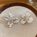 Open Hammered Flower Stud Earrings in Gold and Silver Tone view 7