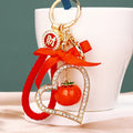 Jeweled Double Heart and Persimmon Keychains with Red Bow Accent view 7