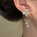 White Flower Stud Earrings with Clear Crystal Teardrops view 4