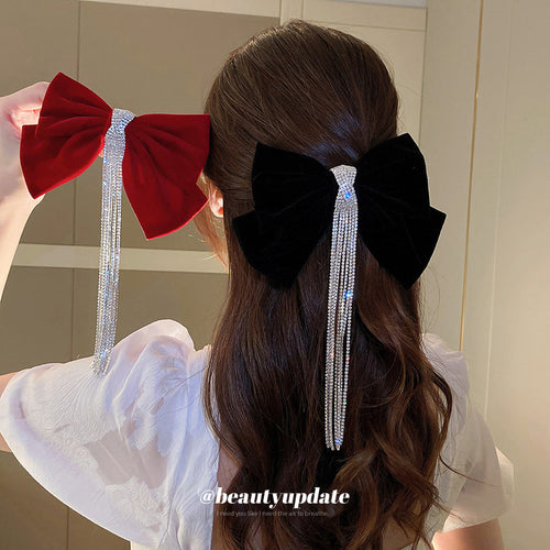 two visibly different velvet bow hair clip designs shown in the first close product view