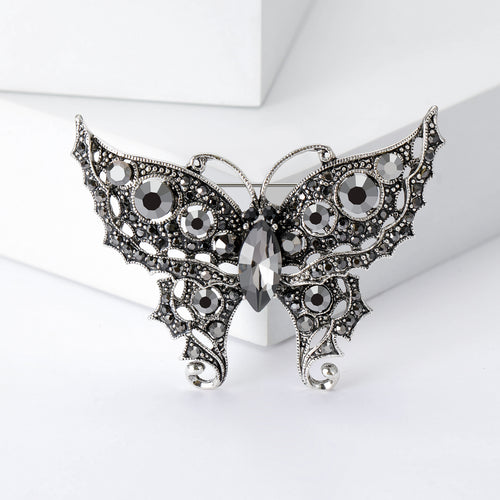 Black gray crystal filigree butterfly brooch front close-up