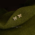 Mini Openwork Bow Stud Earrings In Gold And Silver Tone view 4