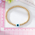Gold Tone Beaded White Blue Evil Eye Stretch Bracelet view 5