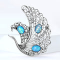 Openwork Swan Brooch In Metal With Filigree Wings And Three Iridescent Cabochons view 2