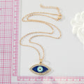 Gold Tone Crystal Halo Navy Evil Eye Pendant Necklace view 2