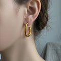 Irregular Rounded C Hoop Earrings in Polished Gold Tone view 3