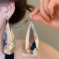 Faceted Teardrop Metal Earrings in Four Gold and Silver Finishes view 3