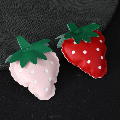 Pink and red PU leather strawberry charms with green leaf tops and white polka-dot stitching