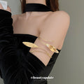 Leaf Wrap And Sculptural Wave Open Arm Cuffs In Gold Or Silver Tone view 1