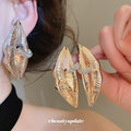 Sculptural Metal Lip Stud Earrings In Gold And Silver view 1