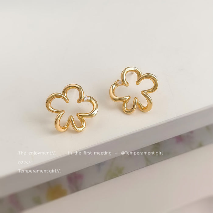Gold Tone Open Flower Outline Stud Earrings with CZ