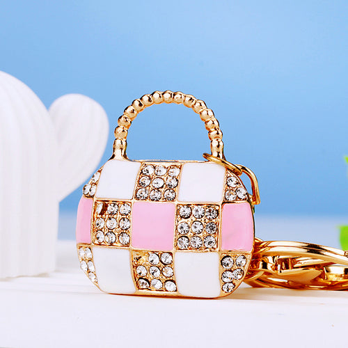 A second supplied view shows another pictured color or design of the checkerboard handbag keychain.