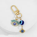 Gold Tone Evil Eye Charm Keychain With Hamsa Hand Accent view 7
