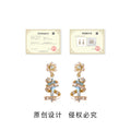 Snowflake Light Blue Spiral Ribbon Drop Earrings CZ view 3