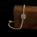 Gold Tone Tennis Bracelet With Square Clear Crystal Halo Center view 3