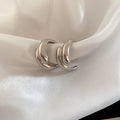 Crossed Triple Hoop Earrings in Gold and Silver Tone view 7