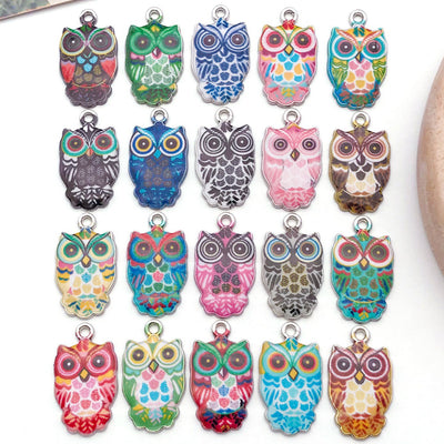 Colorful insect charms arranged on a light background