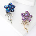 Crystal Rose Stem Brooch In Purple Or Blue With Polished Metal Detail view 1