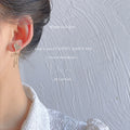Gold Tone Bow And White Heart Asymmetric Stud Earrings view 2
