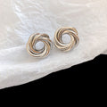 Sculptural Knot Stud Earrings In Gold And Silver Tones view 7
