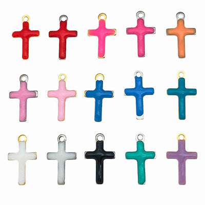Colorful cross charms arranged on a light background