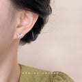Beige Cat-Eye Glass Butterfly Stud Earrings Gold CZ Accents view 2