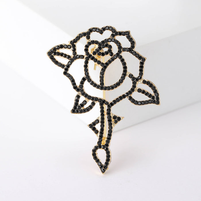 Black Openwork Stemmed Rose Brooch with Gold Tone Outline