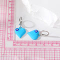 Silver Tone Puffy Heart Evil Eye Huggie Earrings in Five Colors view 5