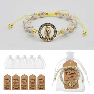 White cross bead bracelet displayed with five sheer pouches, five thank-you tags, and one assembled set.