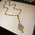 Brown Beaded Necklace with Ornate Teardrop Pendant view 6