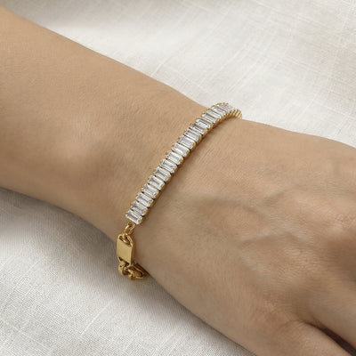 On-wrist view of crystal baguette and plate link bracelets in main image 1.