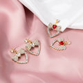 Clear Stone Heart and Bow Gold Tone Dangle Stud Earrings view 1
