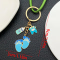 Eight Pink Baby Outfit and Footprint Metal Keychain Designs view 7