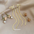 Gold Tone Pearl Butterfly Bow Earring Three Pair Sets view 3