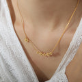 Delicate Gold Daisy Flower Bar Necklace Side Charm view 1
