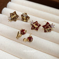 Gold Tone Star Stud Earrings with Red Brown Inlay Designs view 3