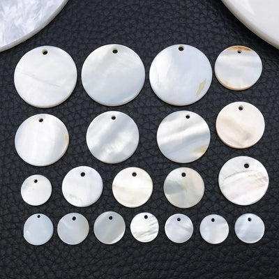 Blue shell charms arranged on a light background