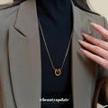 Red Teardrop Gold Tone Necklace With Polished Metal Tone Details view 1