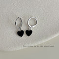 Silver Huggie Hoop Earrings With Black Heart Charm view 2